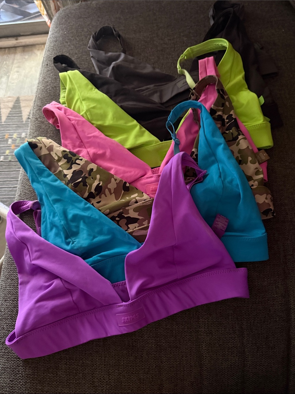 Skims swim tops in Purple, Teal, Pink, grey, black, Camo & Neon Green